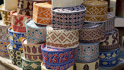  traditional Muslim headwear on a market on zanzibar