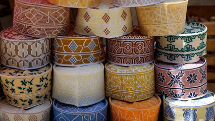 traditional Muslim headwear on a market on zanzibar