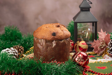 Christmas table with panettone, beautiful table decorated with Christmas objects and a delicious panettone, selective focus.