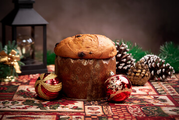Christmas table with panettone, beautiful table decorated with Christmas objects and a delicious panettone, selective focus.