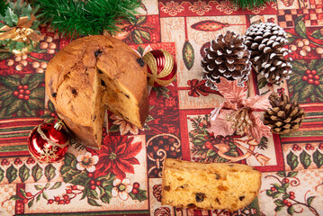 Christmas table with panettone, beautiful table decorated with Christmas objects and a delicious panettone, selective focus.