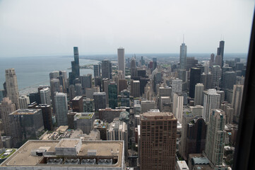 Looking down at downtown chicago from the top of a building