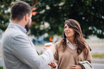 Business people talking and having coffee break outdoors