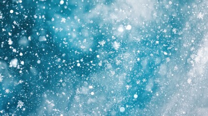 Fototapeta premium Falling snowflakes and icy particles in a wintery scene.