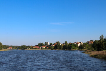 View from Lake Widmińskie towards the summer resort of Wydminy, Poland, Warmian-Masurian Voivodeship