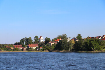 View from Lake Widmińskie towards the summer resort of Wydminy, Poland, Warmian-Masurian Voivodeship
