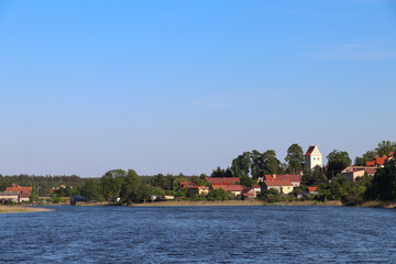 View from Lake Widmińskie towards the summer resort of Wydminy, Poland, Warmian-Masurian Voivodeship