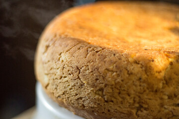 Freshly baked homemade bread is lying and cooling down.