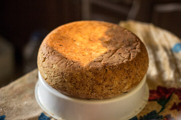 Freshly baked homemade bread is lying and cooling down.