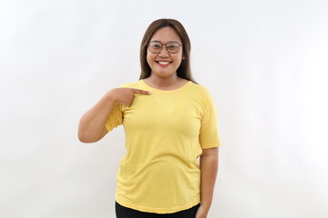 Happy smiling Asian woman points at herself, confident satisfied expression, models over white background