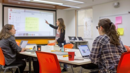 Collaborative team meeting in modern office with interactive whiteboard and digital devices