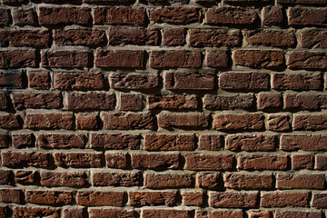 Background of brick wall. Architecture background with wall facade. Stone cladding wall background. Brick surface background for poster or banner.
