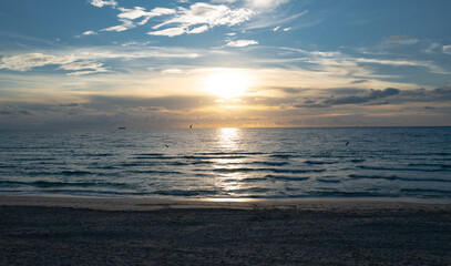 Sunrise sea. Calm sea with sunset sky through the clouds over. Meditation ocean and sky background. Tranquil seascape. Horizon over the sunset sea water. Calm sea with sunset sky.