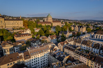 Obraz premium Beautiful aerial view of the city of Zurich in Switzerland - the Limmat River and its iconic churches, buildings rivers and Clockes.