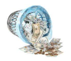 Many dollar banknotes, overturned trash bin and coins isolated on white