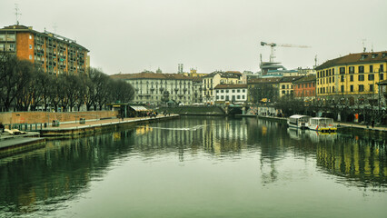 Fototapeta premium View of Naviglio Grande canal with arched footbridge, Old Milan, Italy