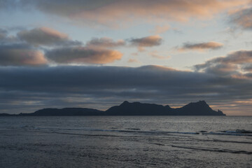 A beautiful sunset over rocky features at the beach