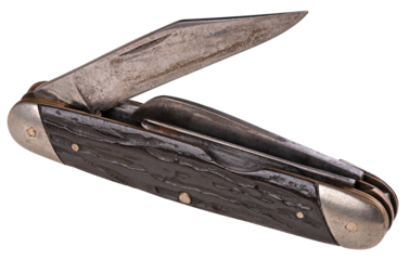 Old pocket knife with several blades on isolated background.