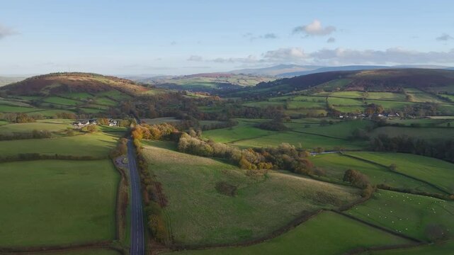 Farms over Trecastle from a drone at sunset, Brecon Beacons National Park, Powys, Wales, England
