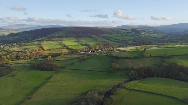 Farms over Trecastle from a drone at sunset, Brecon Beacons National Park, Powys, Wales, England