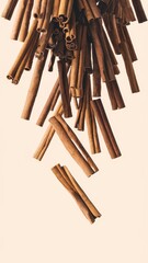 Cinnamon sticks arranged artistically against white background, isolated