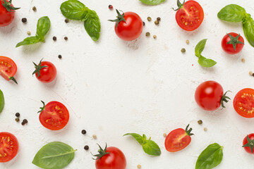 Fresh tomatoes, basil, sea salt and spices on concrete background, top view