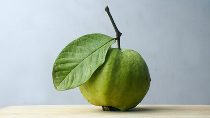 Ripe crystal guava on wooden table. Focus selected, white background