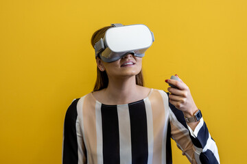 Young woman wearing a virtual reality device, viewing a virtual world in augmented reality....