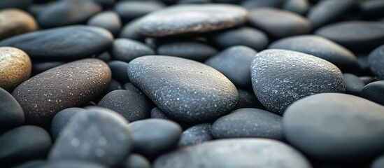 A variety of black pebbles that are ideal for decorative use in gardens or paths
