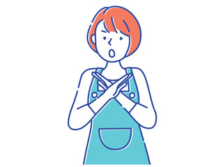 手でバツを作るエプロン姿の女性