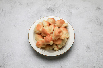 Mini croissant in white pate. French bakery, sweet dough dessert. Breakfast baked. Coffee break.