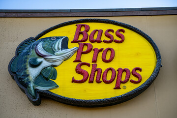 Naklejka premium Bass Pro Shops sign. Bass Pro Shops is an American privately held sporting goods retailer. Vaughan, Canada - November 2, 2024.