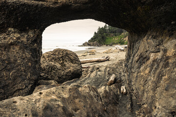 Tunnel Through Rock Formation Along Coast In Olympic