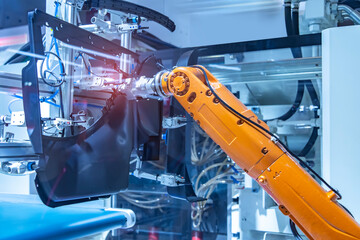 industrial machine and factory robot arm with part of car,Smart factory industry 4.0 concept.