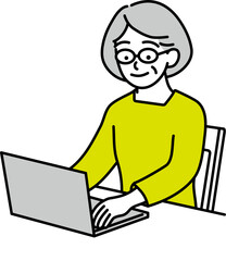 パソコンに向かう年配の女性