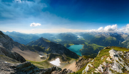 A breathtaking panorama of a majestic mountain range with a crystal-clear lake nestled amidst snow-capped peaks