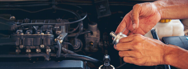 Banner Man hands fixing Car machinery vehicle mechanical service. Mechanic man hands repairing car shop. Panorama open vehicle hood checking up auto mobile. Car maintenance engineer with copy sapce