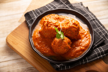 Meatballs in red chipotle chili and tomato sauce, ground pork or beef stuffed with cheese. A very popular homemade food recipe in Mexico and other countries, commonly served with rice.