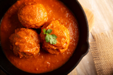 Meatballs in red chipotle chili and tomato sauce, ground pork or beef stuffed with cheese. A very popular homemade food recipe in Mexico and other countries, commonly served with rice.