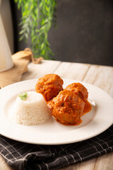 Meatballs in red chipotle chili and tomato sauce, ground pork or beef stuffed with cheese. A very popular homemade food recipe in Mexico and other countries, commonly served with rice.