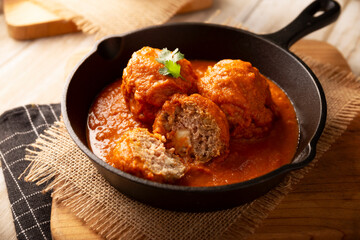 Meatballs in red chipotle chili and tomato sauce, ground pork or beef stuffed with cheese. A very popular homemade food recipe in Mexico and other countries, commonly served with rice.