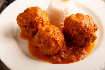 Meatballs in red chipotle chili and tomato sauce, ground pork or beef stuffed with cheese. A very popular homemade food recipe in Mexico and other countries, commonly served with rice.