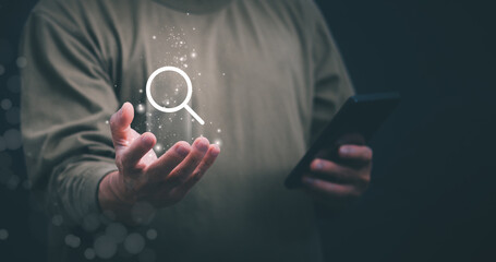 Information search technology, search engine optimization, male hand using a smartphone to search information, using the search bar function on your website