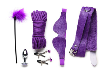 Purple sex toys on white background