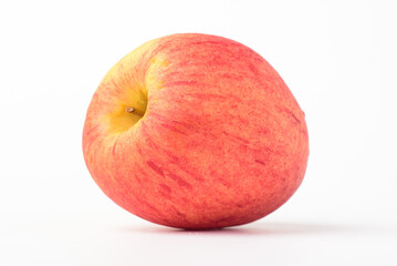 Fresh ripe apple with tiny water drops on white background