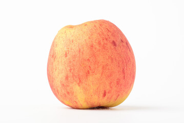 Fresh ripe apple with tiny water drops on white background