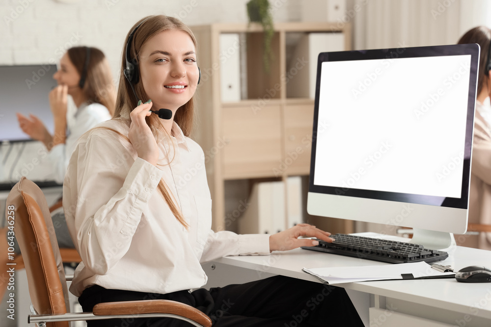 Poster female technical support agent working with computer at table in office