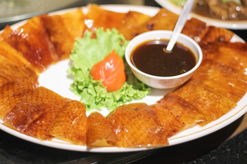 Peking Duck with sauce or Chinese food traditional Asian style