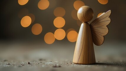A handcrafted wooden angel figure with wings stands gracefully against a backdrop of glowing bokeh lights in a serene setting
