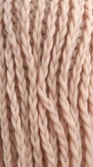 Close-up shot of a beautifully textured natural wool knitting background, textile